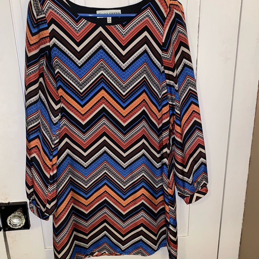 Long sleeve thigh length dress.